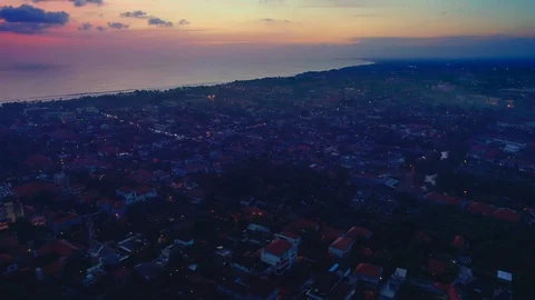 Flying at sunset over the city overlooking the ocean Stock Footage 108803153