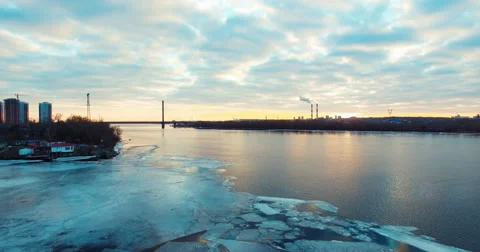 Flying at Sunset Over the Water to the Bridge in the City Stock Footage 59955259