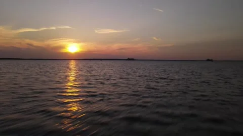 Flying Sunset Over Water Stock Footage