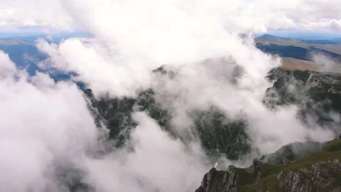 Flying though clouds in Bucegi Moutains, Romania. Aerial view. Stock Footage 130852923