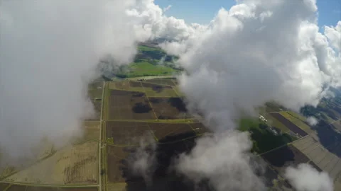 Flying though clouds over agriculture farm lands northern Ca. Stock Footage 240414625