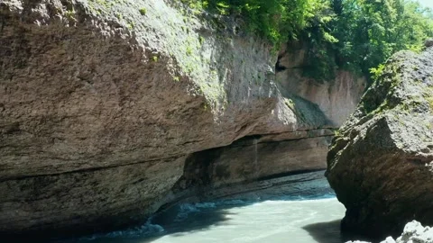 Flying on a throne over a mountain river in a gorge Stock Footage 160605763