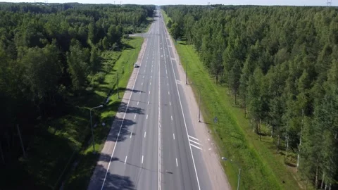 Flying on a throne over a road in the middle of the forest Stockbeeldmateriaal 165603086