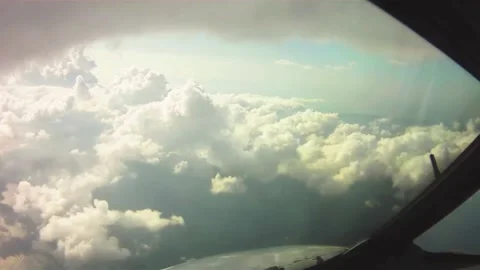 Flying through amazingly beautiful cloudscape. Direct view from the cockpit. Stock Footage 237152117