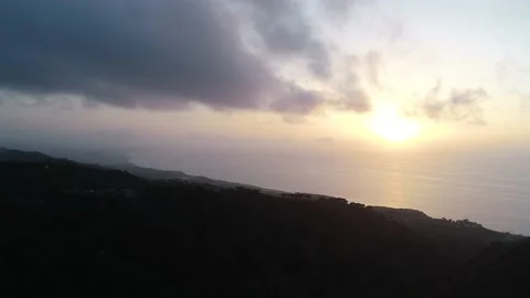 Flying through and over clouds at sunset  Video stock 145875885