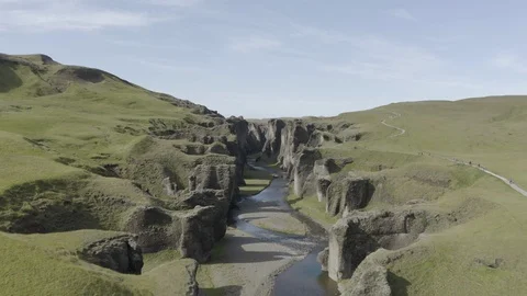 Flying through and then above the Fjadrargljufur Canyon Stock Footage 125220932