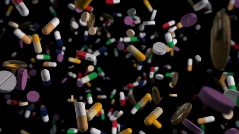 Flying through Assorted Colorful Pills on Black Stock Footage 117488635