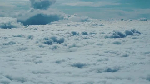 Flying through beautiful clouds in an airplane Stock Footage 126320650