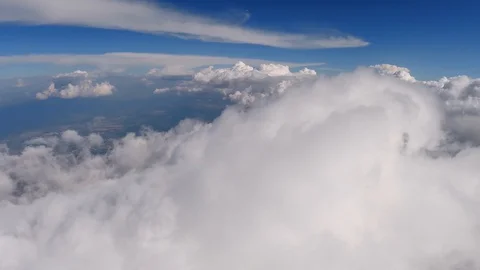 Flying through beautiful thick fluffy clouds. Direct view from the Drone. Stock Footage