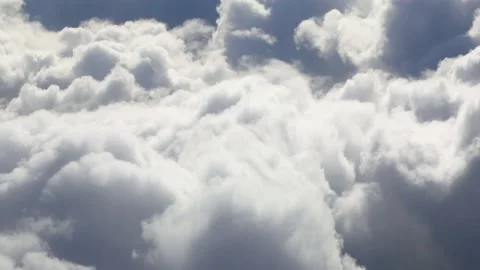 Flying through beautiful thick fluffy clouds. Stock Footage 150071356