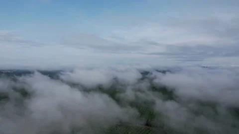 Flying through beautiful thick fluffy clouds. Amazing timelapse of soft white cl Stock Footage 164595584