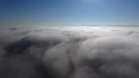 Flying through beautiful thick fluffy clouds. Amazing timelapse of soft white Stock Footage 165338835