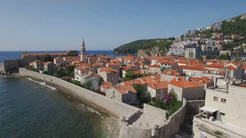Flying through Budva Montenegro old town towards city beach 스톡 동영상 78006677