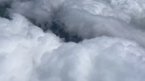 Flying through the clouds above London Stock Footage 276387770