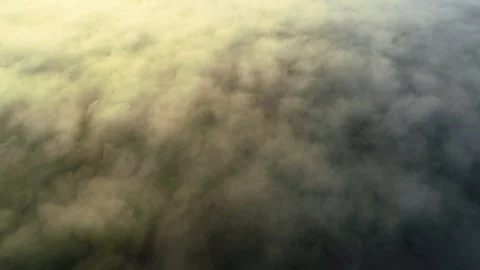 Flying through the clouds above mountain tops. 4K. Stock Footage 115643055