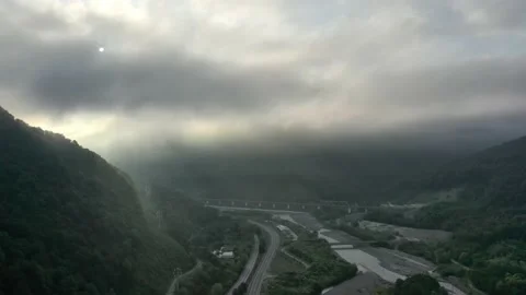 Flying through the clouds above mountain tops. High peaks wonderful morning Vidéo 145575558