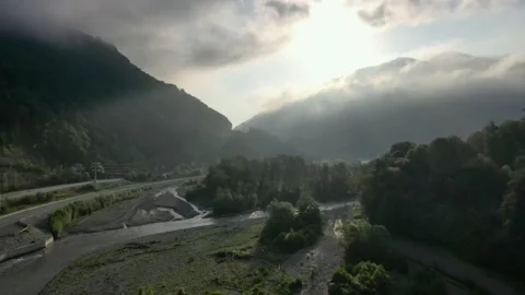 Flying through the clouds above mountain. High peaks wonderful morning sunrise Vidéo 145575636