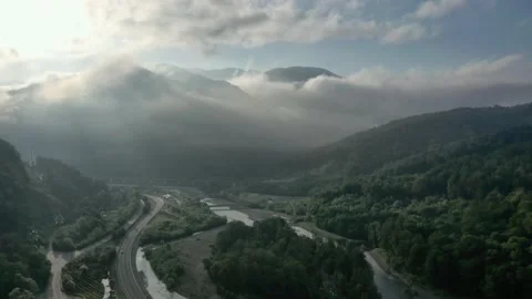 Flying through the clouds above mountain tops. High peaks wonderful morning Vidéo 145575654