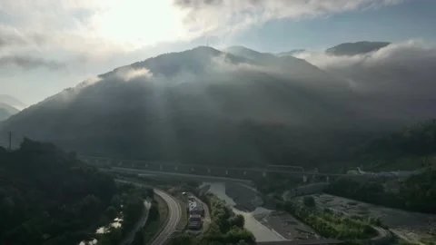 Flying through the clouds above mountain tops. High peaks wonderful morning Vidéo 145575681