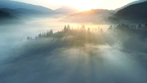 Flying through the clouds above mountain tops. High peaks wonderful morning Stock-Footage 154064699
