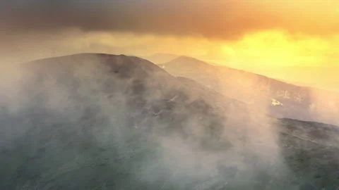 Flying through the clouds above mountain tops Stock Footage 154446618