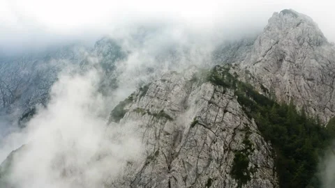 Flying Through the Clouds Above Mountain Tops. High Peaks Natural Landascape. Video stock 168139878