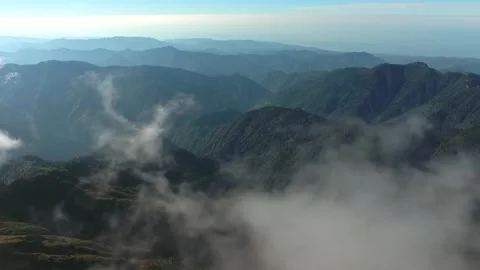 Flying through clouds above untouched forested - Cascades North and Fly Through Video stock 339373972
