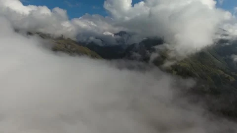 Flying through clouds above untouched - Cascades North and Protected Wilderness Stock Footage 339375193