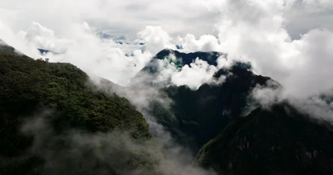 Flying through clouds in Andes mountains near Machu Picchu, Peru Stock Footage 334344336
