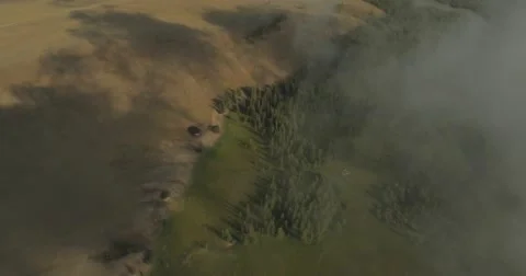 Flying through clouds with beautiful landscape view over the mountains. Stock Footage 62221013