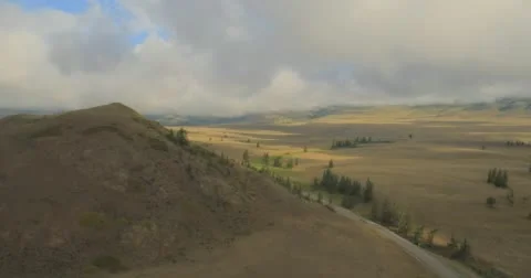 Flying through clouds with beautiful landscape view over the mountains. Stock Footage 62224756