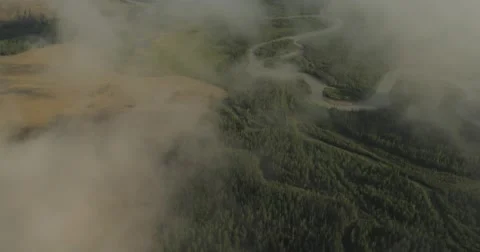 Flying through clouds with beautiful landscape view over the mountains. Stock Footage 62226910