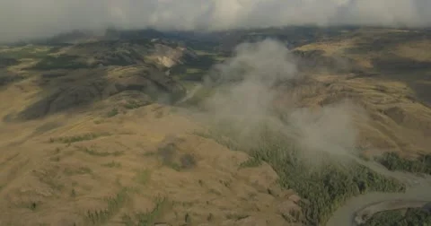 Flying through clouds with beautiful landscape view over the mountains. Stock Footage 62230687