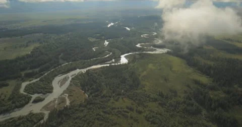 Flying through clouds with beautiful landscape view over the mountains. Stock Footage 62237291
