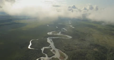 Flying through clouds with beautiful landscape view over the mountains. Stock Footage 62237324