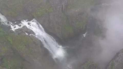 Flying through clouds to the beautiful Voringsfossen Waterfall, Norway Stock Footage 114067593