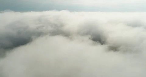 Flying through the clouds cinematic 4k footage Stock Footage 100795867
