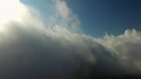Flying through clouds during sunset light over Munduk village in Bali Stock Footage 255415051