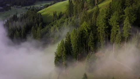 Flying through the clouds mountain tops. High peaks wonderful morning sunrise Stock Footage 169369537