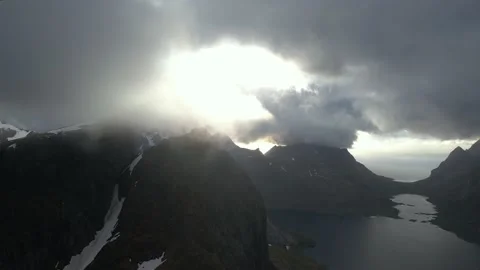 Flying through the clouds in the mountains in 4k at sunset Stock Footage 222002406