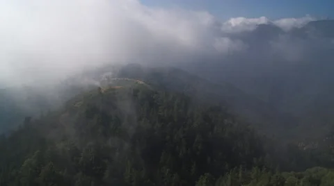 Flying through clouds over the Angeles National Forest in the San Gabriel Stock Footage 59113866
