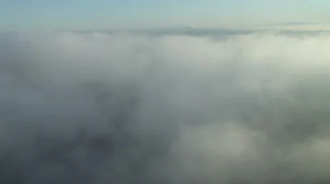 Flying Through Clouds over Forest Stock Footage 43180375