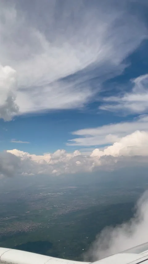 Flying through the clouds over mexico city. Vertical shot. Stock Footage 220810705