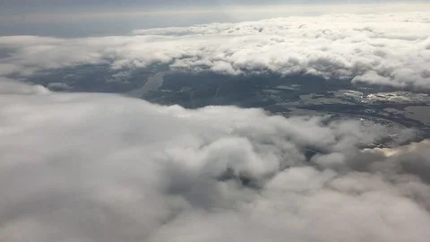 Flying through the clouds, reflecting in river below Video stock 87304236