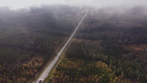 Flying through the clouds - the road going into the distance Stock Footage 142159630