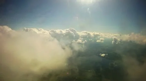 Flying through clouds into sunny weather Stock Footage