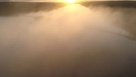 Flying through the clouds at sunset. Aerial view Video stock 117362246