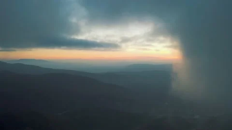 Flying through the clouds at sunset Stock Footage 155335732
