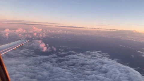Flying through the clouds at sunset Stock Footage 168833455