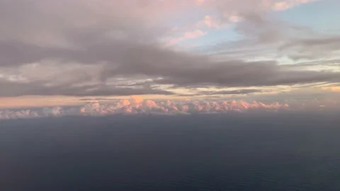 Flying through the clouds at sunset Stock Footage 168833573
